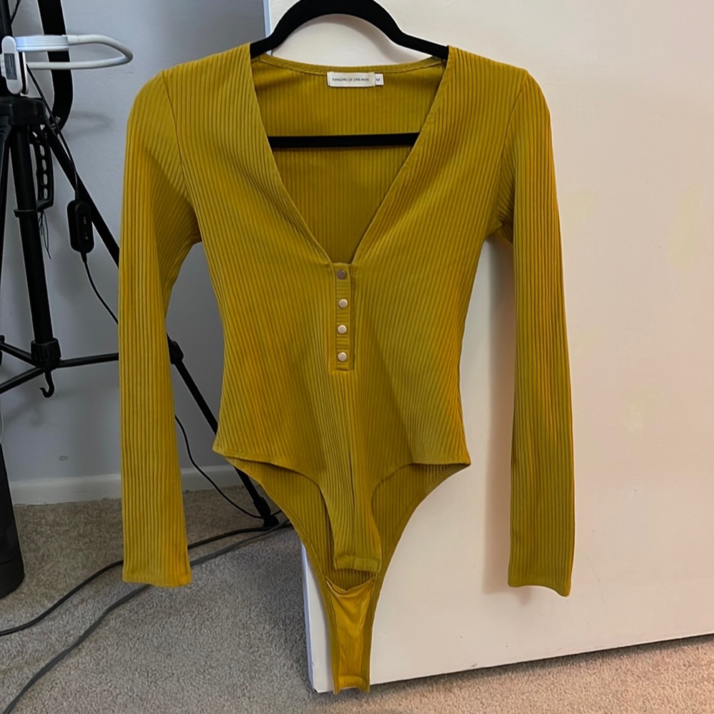 yellow bodysuit